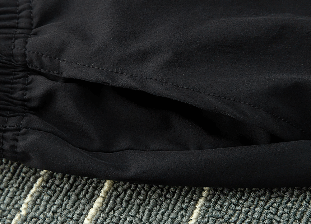 Close-up of side pocket on Quick-drying Sports Pants for Boys with Side Pockets - SF3619, featuring durable black polyester fabric.